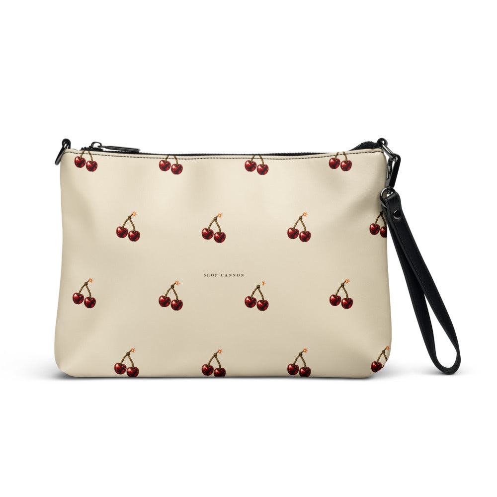 Slop Cannon Cherry Fuse Repeat Crossbody Bag — Cream / black trim — front view; bag only; printed faux leather with black trim; supplier digital mockup.