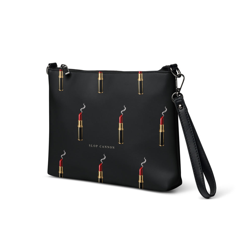 Slop Cannon Loaded Crossbody Bag — Black / black trim — three-quarter front view; bag only; printed faux leather with black trim; supplier digital mockup.