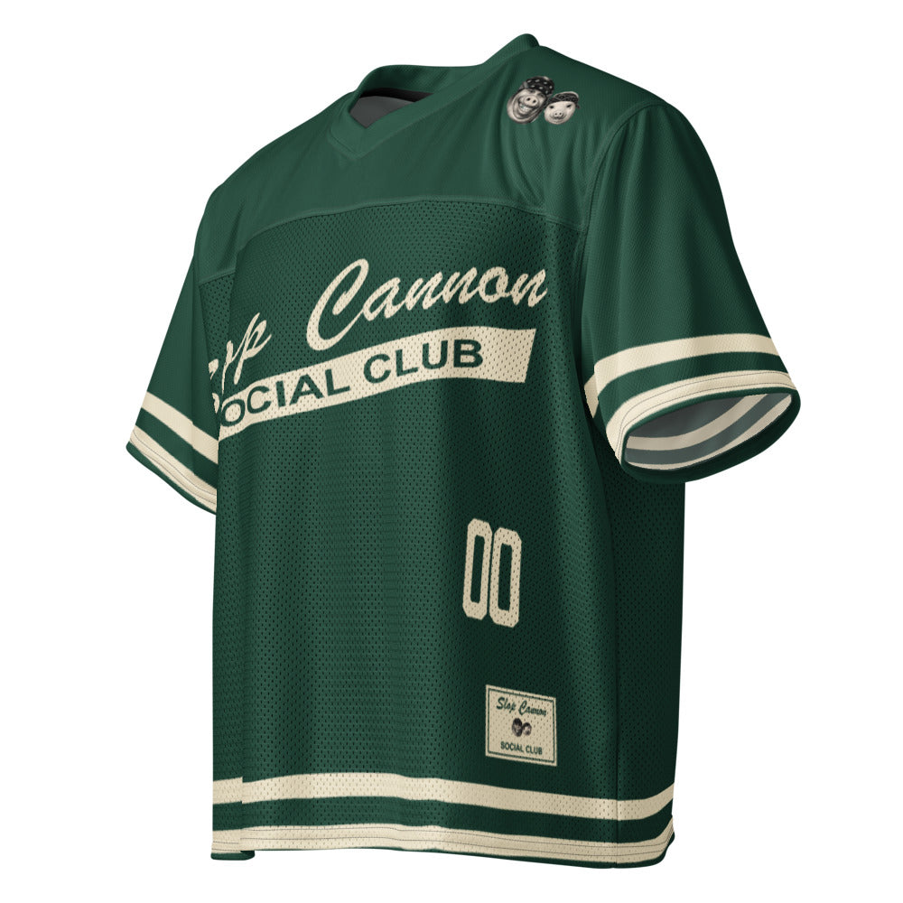 Slop Cannon Social Club — Forest / Cream — three-quarter garment view with printed sleeve and hem stripes; Printful boxy V-neck football jersey White base, printed Forest / Cream; Black stitching; supplier digital mockup.