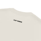 Heavy Block tee — Cream — outside-neckline print detail; AS Colour 5082 Faded Bone; supplier digital mockup.