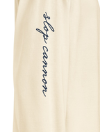 Gallery Script long-sleeve tee — Ecru — right sleeve artwork detail cropped from supplier digital mockup; AS Colour 5081 long sleeve Ecru; supplier digital mockup.