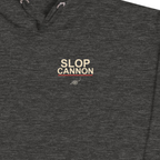MAGAtard Cannonball Hoodie — Charcoal — left-chest wordmark detail cropped from supplier digital mockup; Cotton Heritage M2580 pullover hoodie Charcoal Heather; supplier digital mockup.