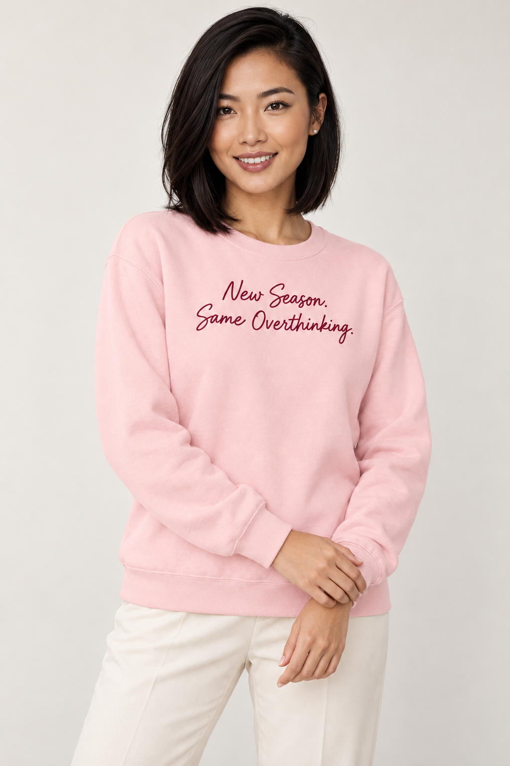 Elise Wu wearing the Light Pink script sweatshirt, close detail view