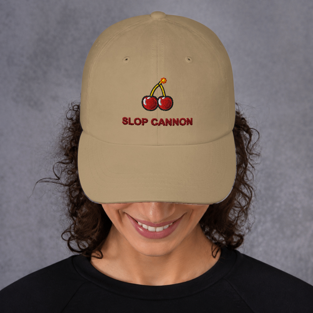 Slop Cannon Cherry Fuse Dad Cap — Khaki — adult model front; exact supplier cap composited onto a digitally generated model; digital mockup, cap only; embroidery preview is not a sewn sample.