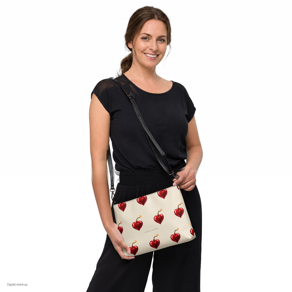 Slop Cannon Heart Fuse Crossbody Bag — Cream / black trim — model-worn front view; bag only; styling clothing excluded; printed faux leather with black trim; digital model composite with exact supplier bag, strap and print pixels. Not a manufactured sample photograph.