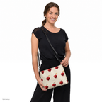 Slop Cannon Heart Fuse Crossbody Bag — Cream / black trim — model-worn front view; bag only; styling clothing excluded; printed faux leather with black trim; digital model composite with exact supplier bag, strap and print pixels. Not a manufactured sample photograph.
