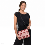 Slop Cannon Short Fuse Crossbody Bag — Blush / black trim — model-worn front view; bag only; styling clothing excluded; printed faux leather with black trim; digital model composite with exact supplier bag, strap and print pixels. Not a manufactured sample photograph.