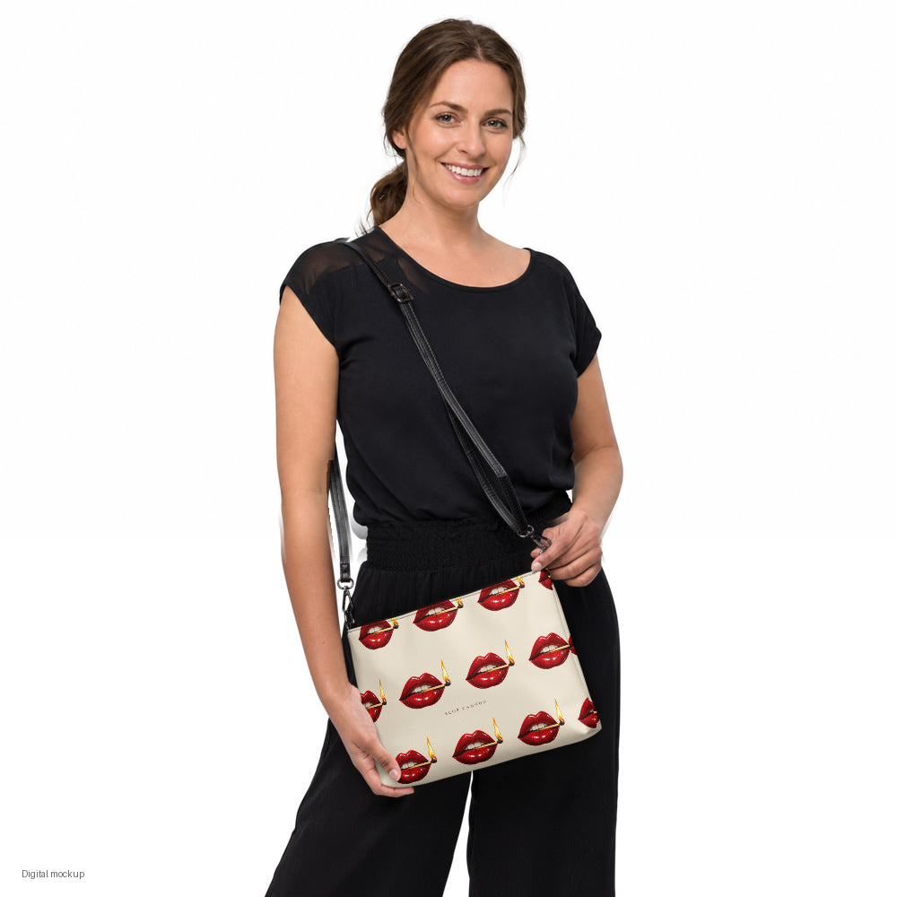Slop Cannon Play With Fire Crossbody Bag — Cream / black trim — model-worn front view; bag only; styling clothing excluded; printed faux leather with black trim; digital model composite with exact supplier bag, strap and print pixels. Not a manufactured sample photograph.