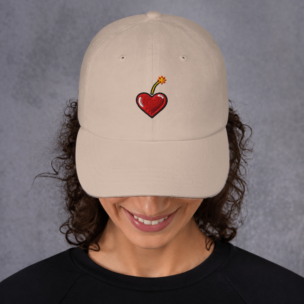 Slop Cannon Heart Fuse Dad Cap — Stone — adult model front; exact supplier cap composited onto a digitally generated model; digital mockup, cap only; embroidery preview is not a sewn sample.
