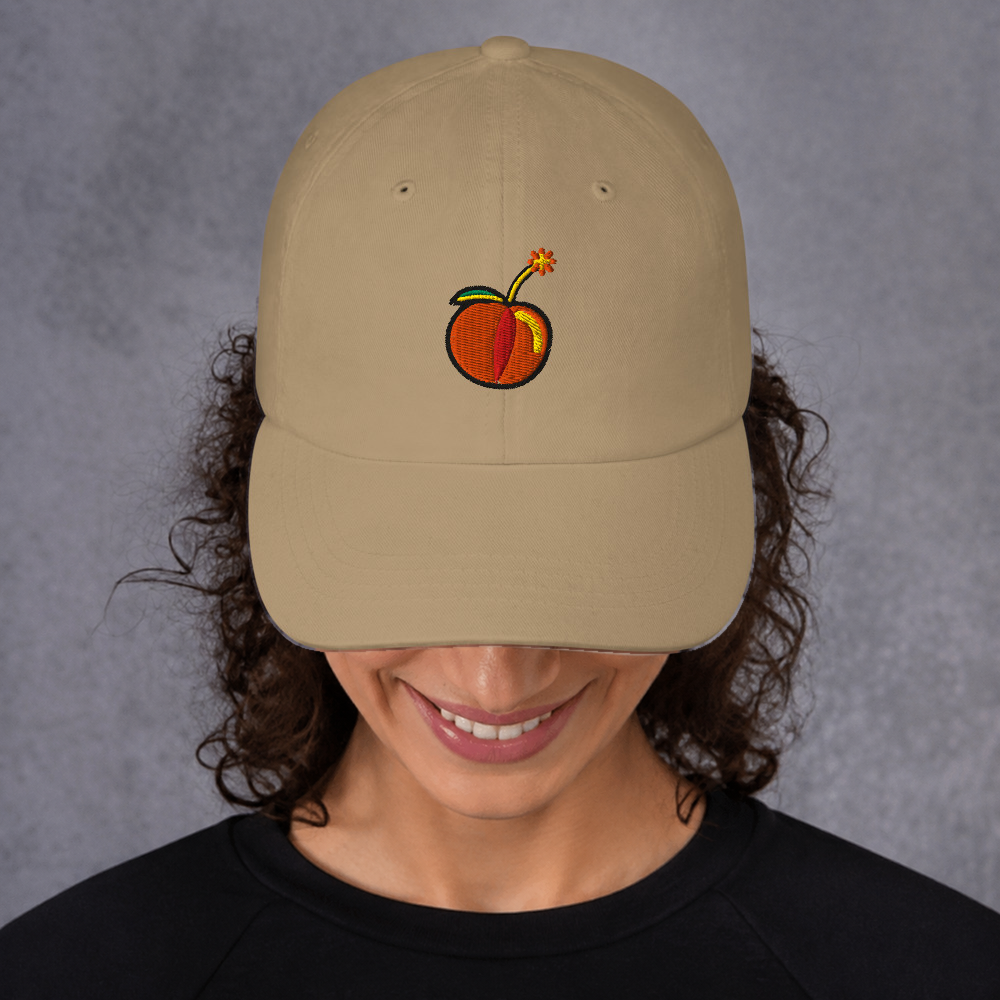 Slop Cannon Hot Piece Dad Cap — Khaki — adult model front; exact supplier cap composited onto a digitally generated model; digital mockup, cap only; embroidery preview is not a sewn sample.