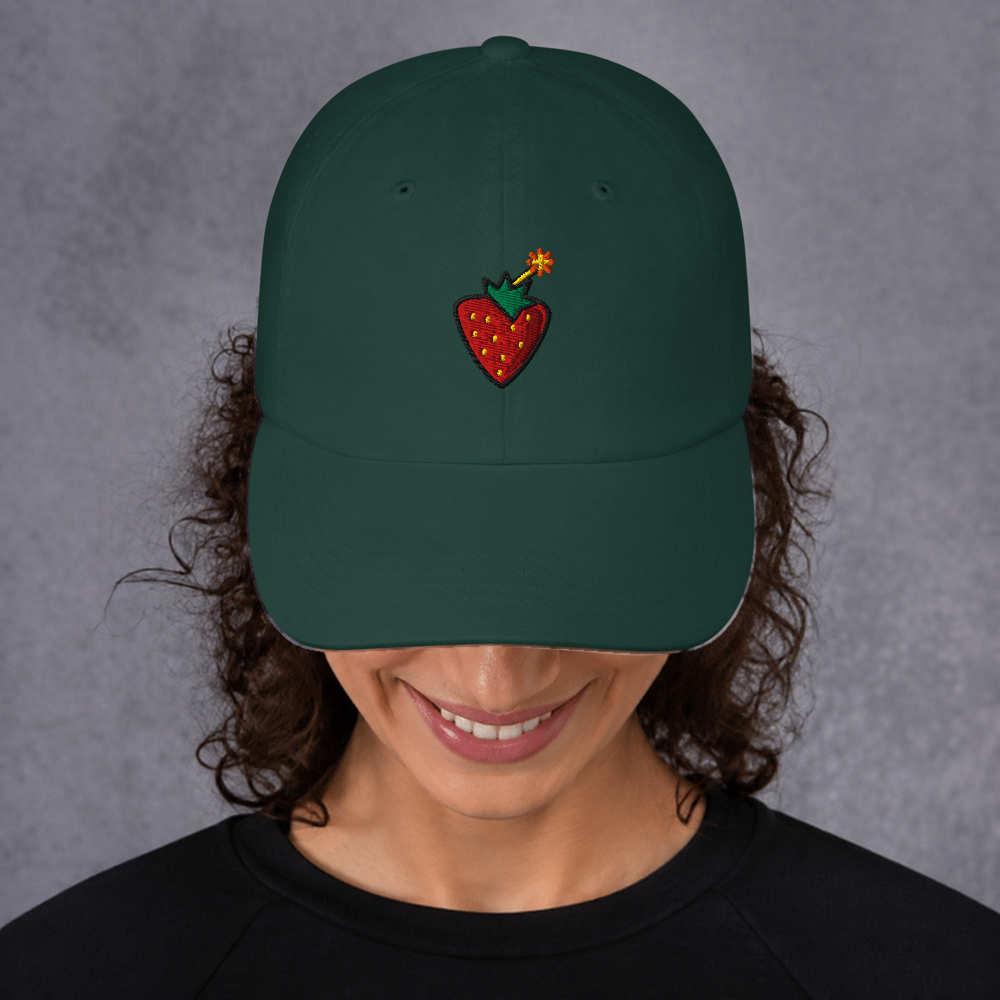 Slop Cannon Sweet Trouble Dad Cap — Spruce — adult model front; exact supplier cap composited onto a digitally generated model; digital mockup, cap only; embroidery preview is not a sewn sample.