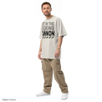 Heavy Block tee — Cream — adult model three-quarter view with exact configured artwork; tee only, styling bottoms excluded; AS Colour 5082 faded tee; digital model composite, not a manufactured sample.