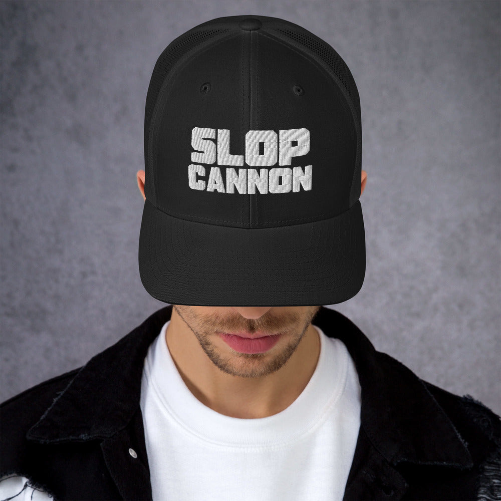 Slop Cannon Heavy Block Trucker Hat — Black / Black / White — adult model wearing the hat; supplier digital mockup; hat only, outfit shown for styling