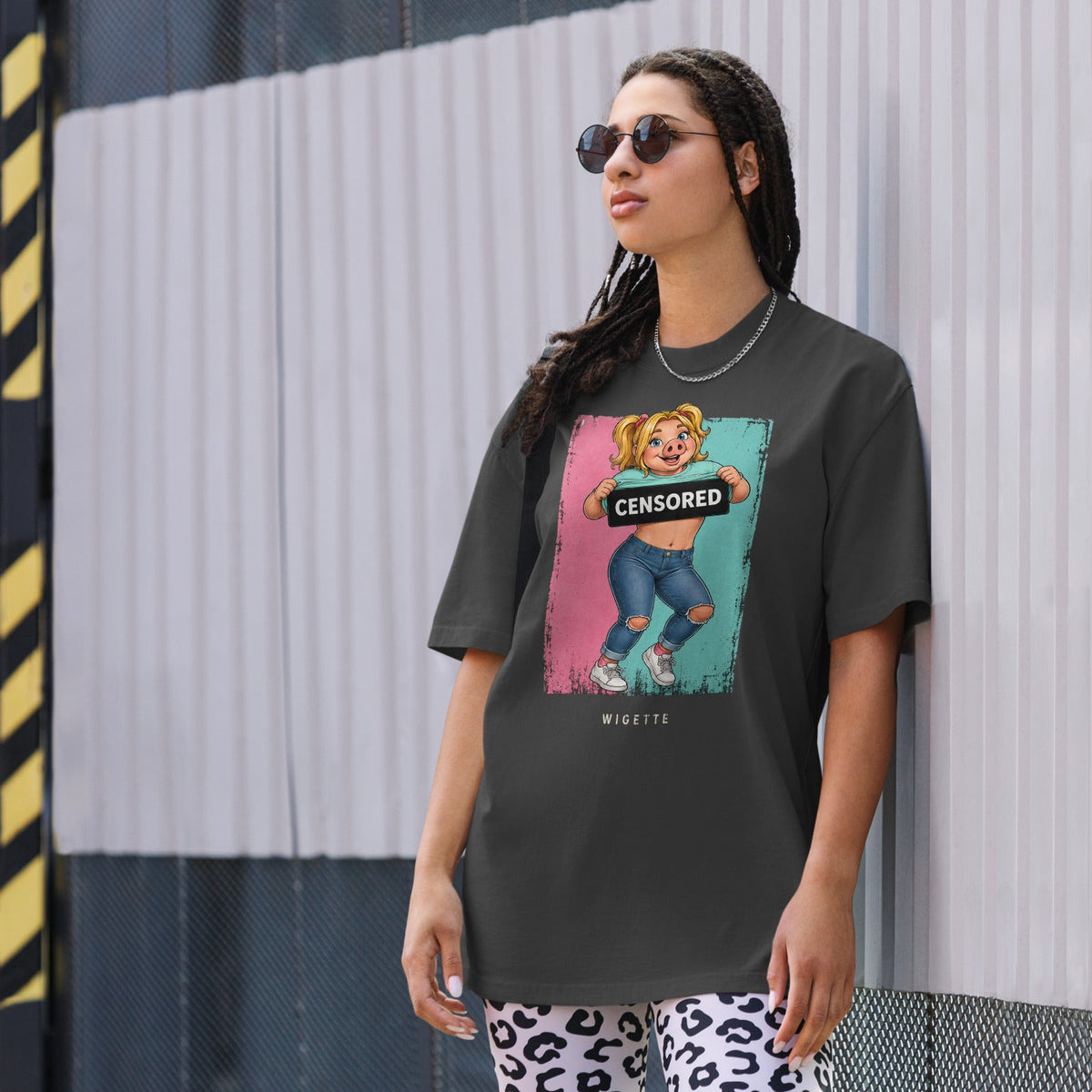 Wigette Censored Colorblock Oversized Tee — Faded Black — adult woman wearing the actual oversized tee lifestyle front view; exact Printful digital mockup, tee only.